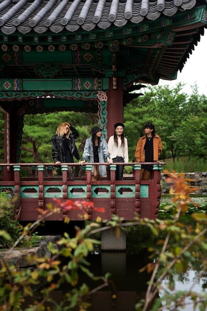 A scene from a historical K-Drama showcasing traditional Korean clothing (Hanbok), architecture (Hanok), and a tea ceremony, emphasizing the attention to detail in cultural representation.