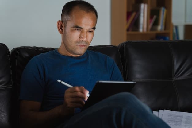 A person looking concerned while reviewing their monthly streaming bills on a tablet, signifying the need for cost management and strategic subscription choices in the US.