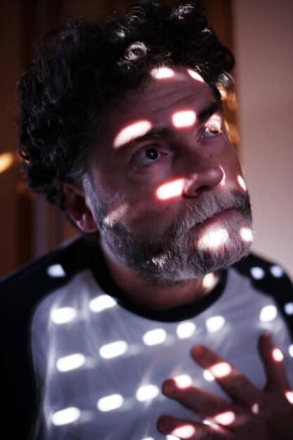 A close-up shot of the lead actor in , conveying a powerful emotion relevant to a pivotal scene in the movie. Focus on the actor's expressive eyes and intense gaze.