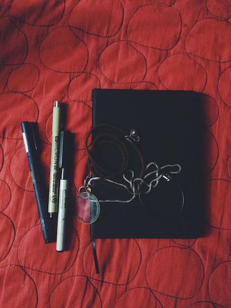 A close-up shot of a critic's notebook and pen, with handwritten notes and scribbles covering the pages. A half-empty cup of coffee sits beside it. The lighting is soft and focused, highlighting the act of thoughtful analysis and note-taking.