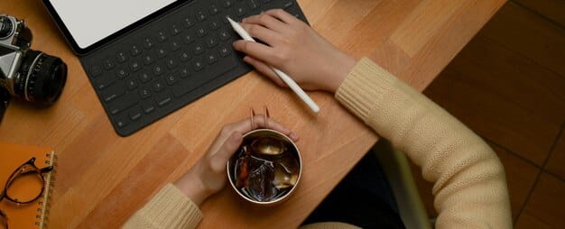 A close-up shot of a writer working on a K-Drama script, with a laptop, coffee cup, and scattered notes visible. The lighting is soft and focused, highlighting the creative process and dedication involved.